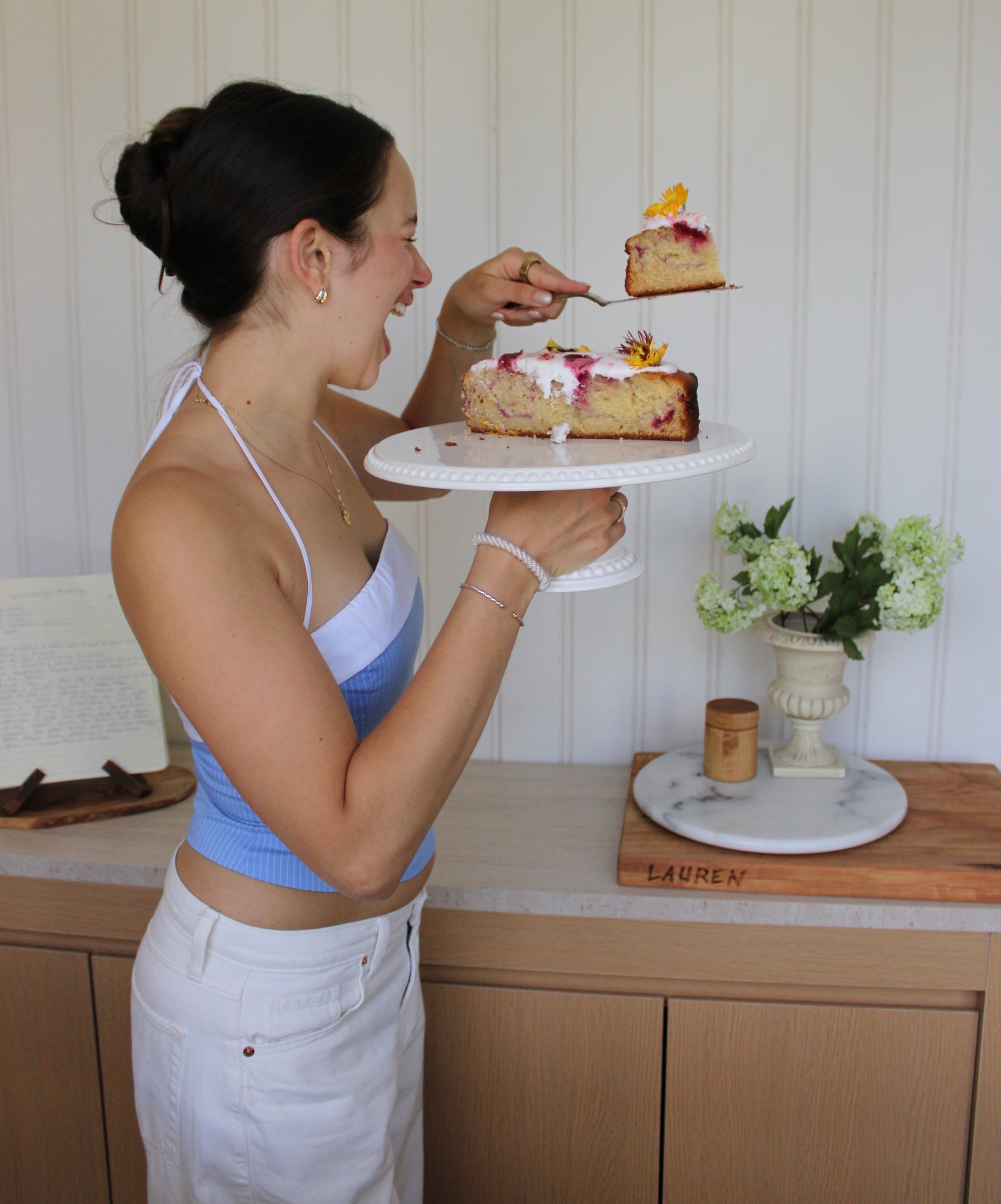 Lauren serving a slice of cake